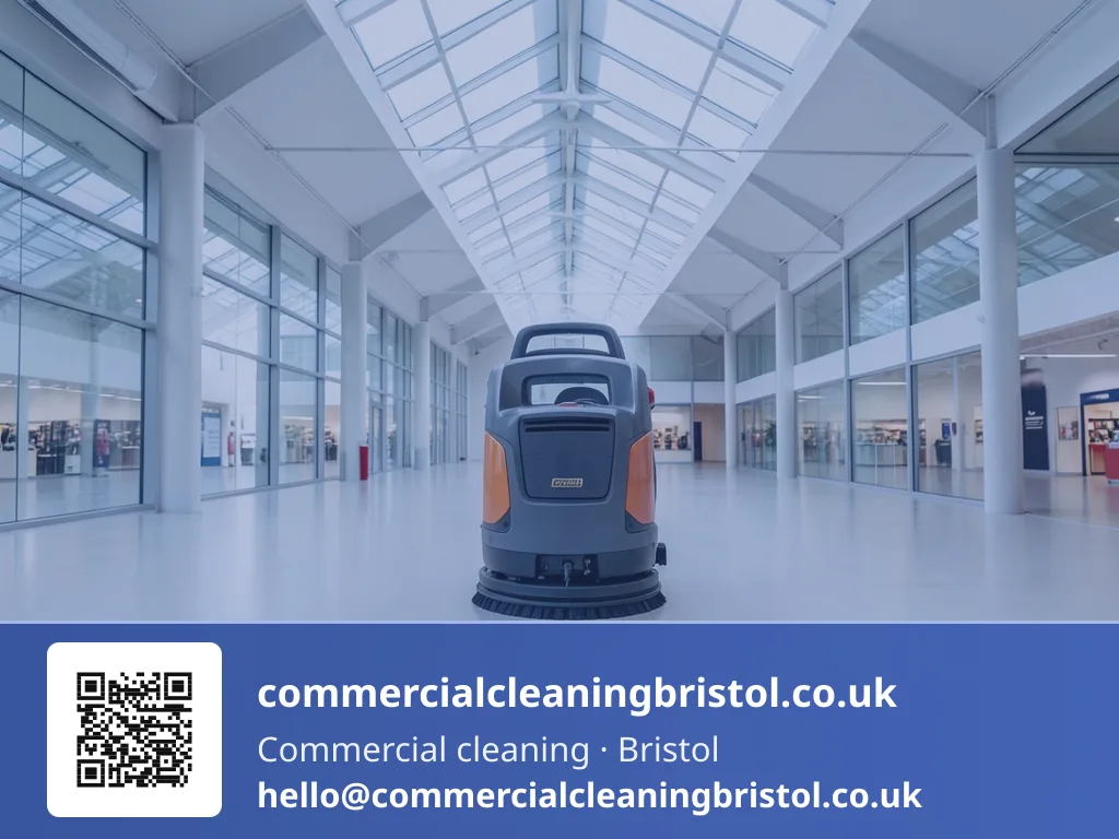 Ride-on rotary floor scrubber working long straight passes down a wide retail-unit floor