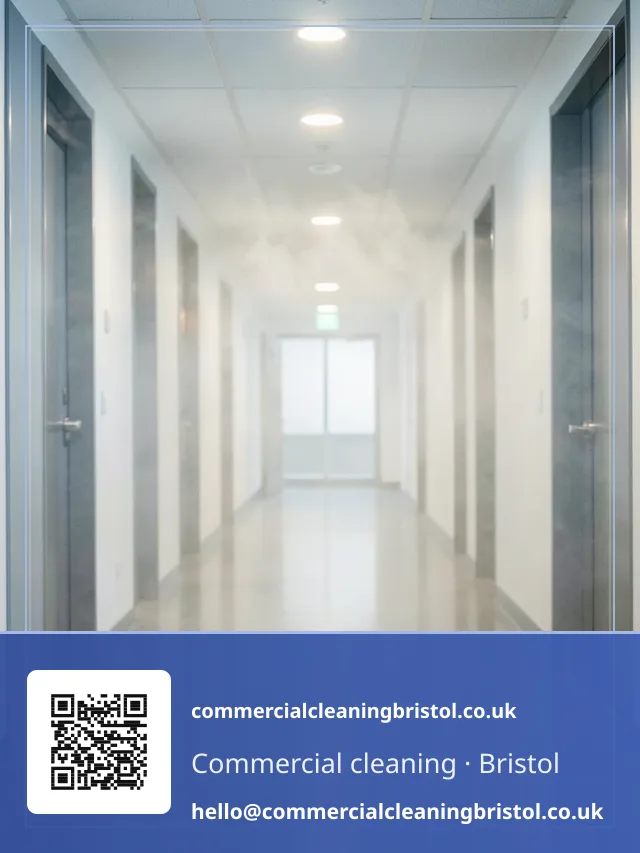 Odour-neutralising fogging machine releasing a fine mist across an empty corridor
