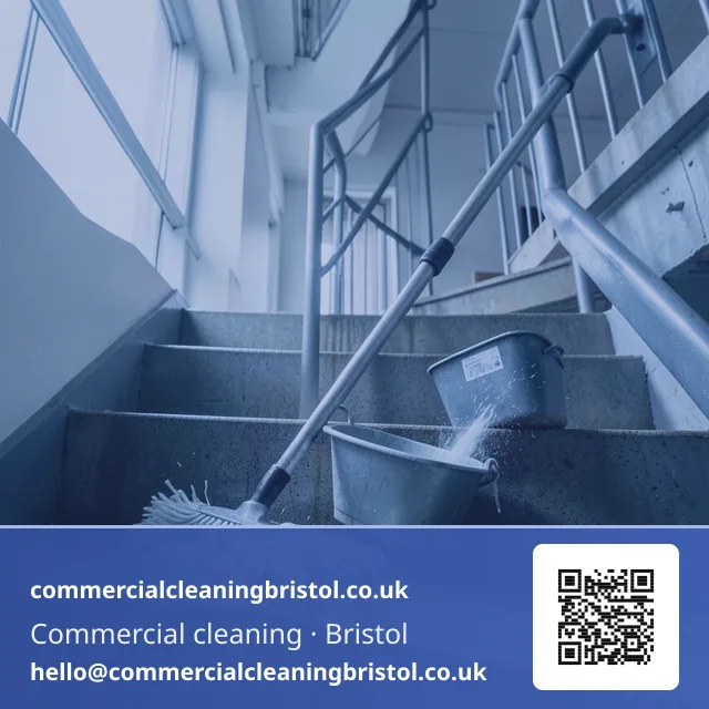 Mop drawn urgently but evenly across a stairwell landing after a leak
