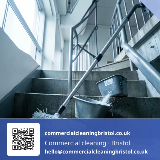 Mop drawn urgently but evenly across a stairwell landing after a leak