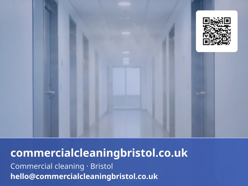 Odour-neutralising fogging machine releasing a fine mist across an empty corridor