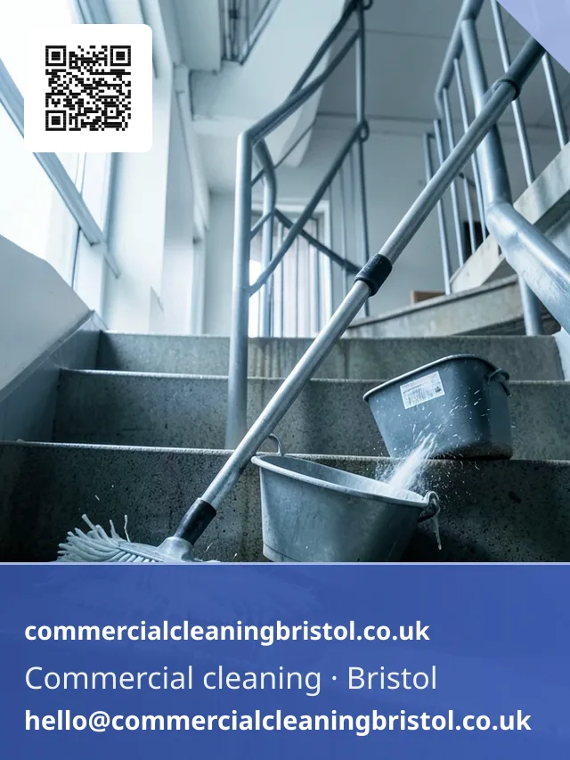 Mop drawn urgently but evenly across a stairwell landing after a leak