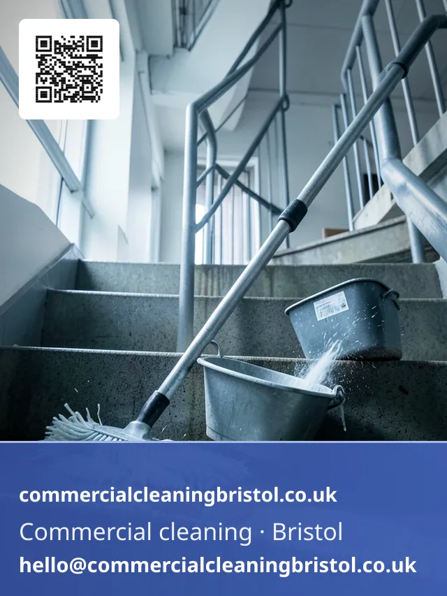 Mop drawn urgently but evenly across a stairwell landing after a leak