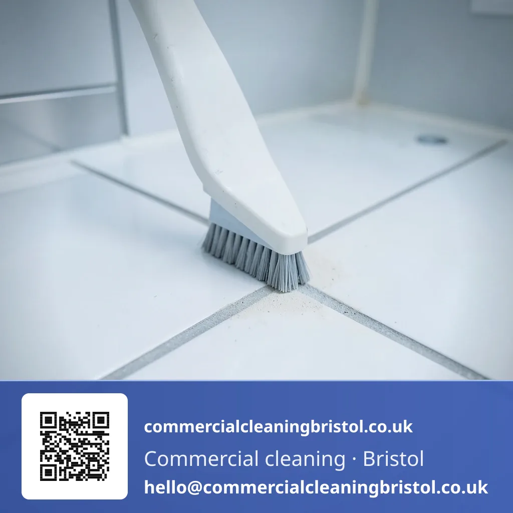 Grout line scrubbed with a narrow brush along a run of washroom floor tiles