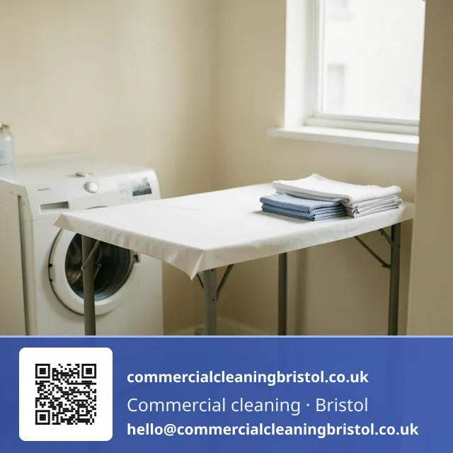 Shared laundry room's folding table wiped down with a microfibre cloth