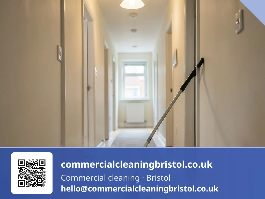 Carpet extraction wand drawn in slow passes across a communal hallway runner shared by several flats