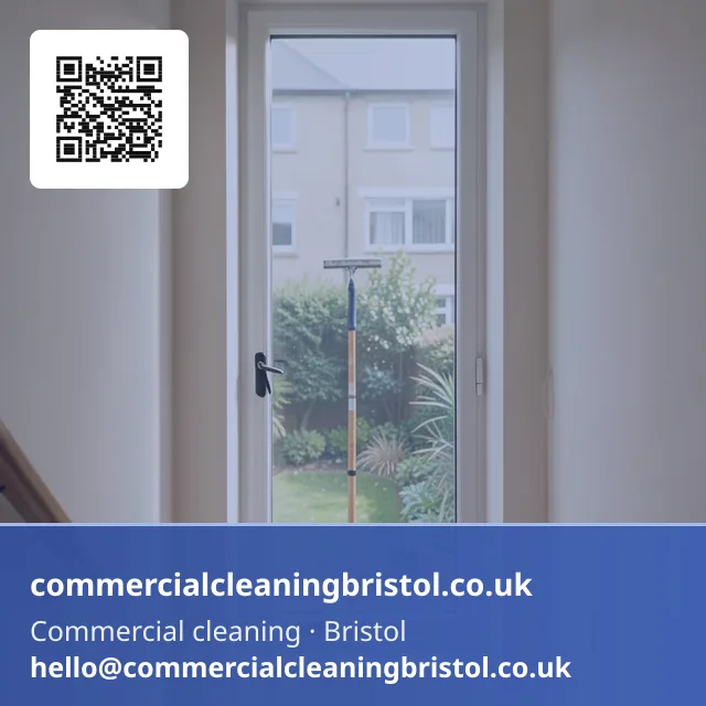 Communal stairwell window cleaned with a squeegee on a short pole