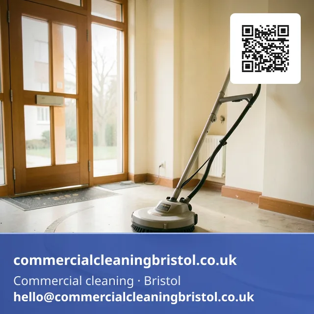 Rotary floor scrubber working a slow arc across a shared apartment-block lobby floor