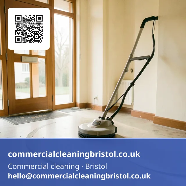 Rotary floor scrubber working a slow arc across a shared apartment-block lobby floor