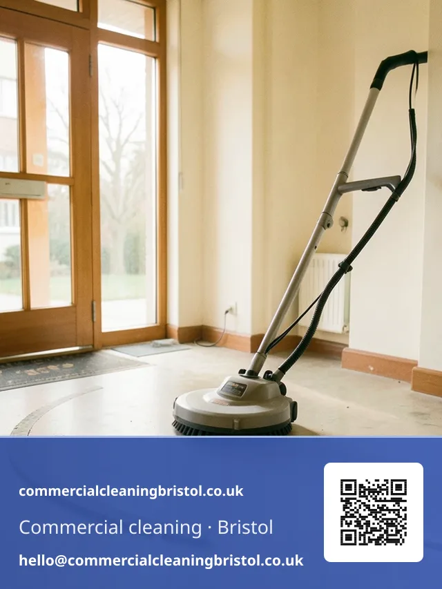 Rotary floor scrubber working a slow arc across a shared apartment-block lobby floor