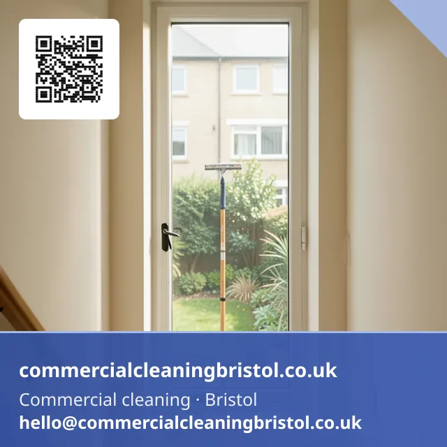Communal stairwell window cleaned with a squeegee on a short pole