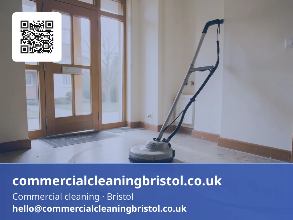 Rotary floor scrubber working a slow arc across a shared apartment-block lobby floor
