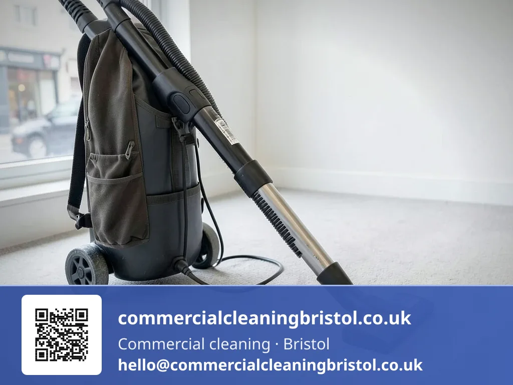 Backpack vacuum's nozzle drawn in overlapping passes across a reception carpet