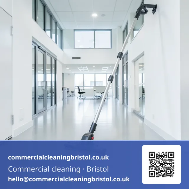 Rotary floor scrubber-drier working a slow straight pass down an open-plan office aisle