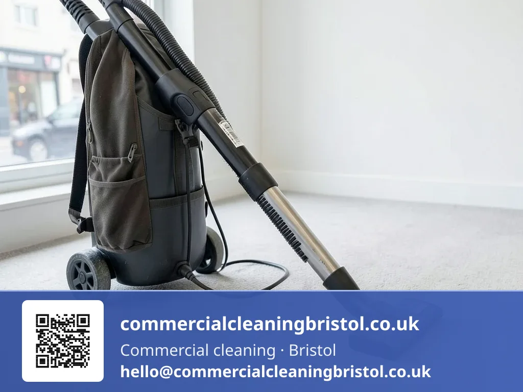 Backpack vacuum's nozzle drawn in overlapping passes across a reception carpet