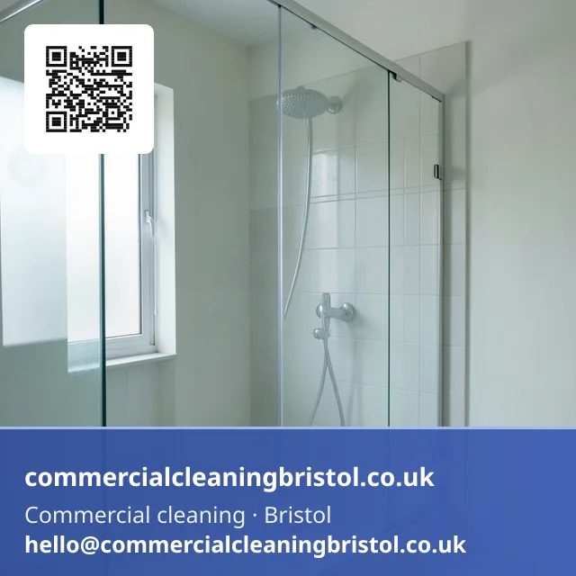 Void flat's bathroom deep-cleaned, a squeegee drawn down the shower screen leaving a single clear arc